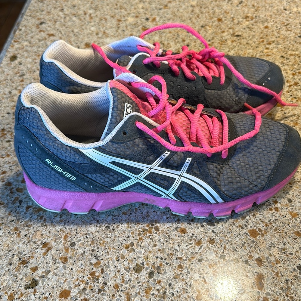 Women’s Asics, size 8 1/2. Gary and pink in color.